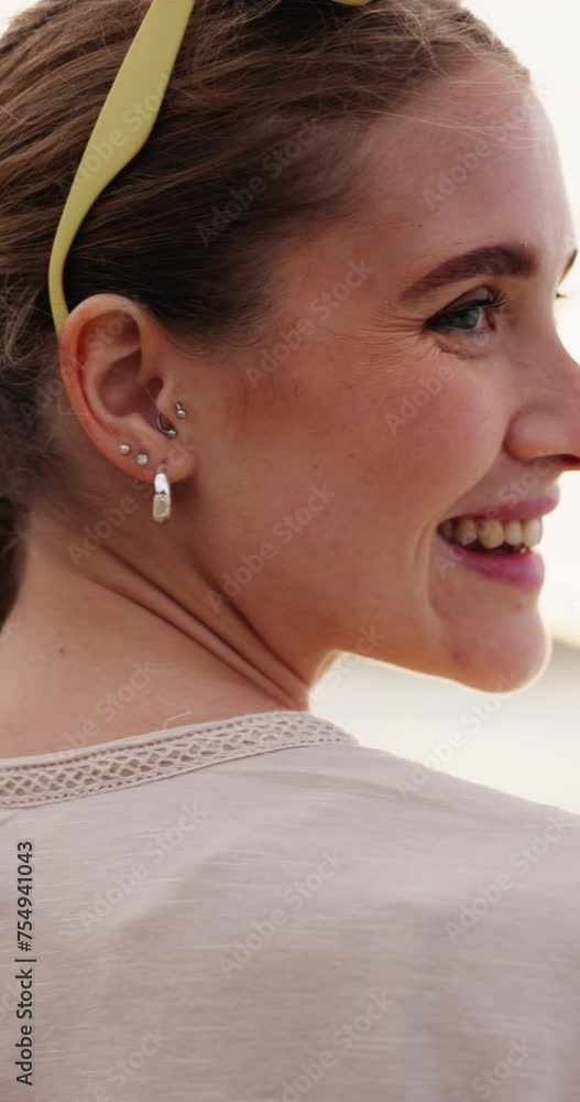 Poster Face, smile and wind with woman at beach in summer for travel, vacation or holiday at tropical location. Portrait, nature and sunshine with happy young tourist at coast by ocean or sea for getaway