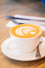 A Perfect Morning: Creamy Latte Art in a Cozy Cafe
