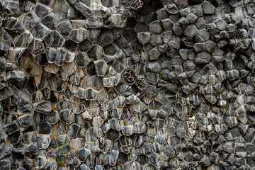 Interesting volcanic rock shapes, scenic basalt column pattern and texture. Natural abstraction and background concepts.