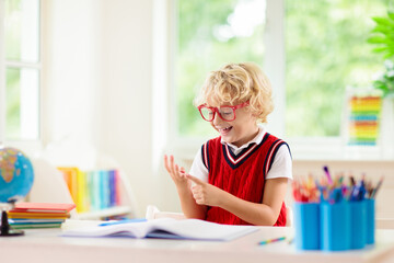 Kids doing homework. Children go back to school.