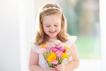 Little girl with flower bouquet