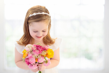 Little girl with flower bouquet