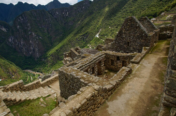 Overview of the characteristic stone houses in the famous 15th century archaeological site of Machu Picchu located in the Andes of Peru, designated a UNESCO World Heritage Site in 1983