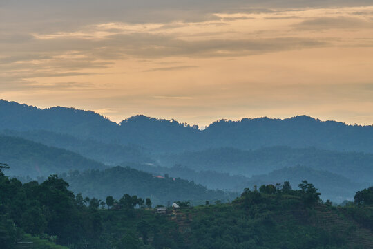 View of the hills in the afternoon after the rain is filled with mist