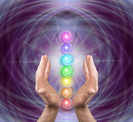 Reiki master offering the seven chakras - purple symmetrical ethereal background square with male...