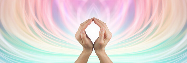Colour energy healing therapist background message banner - hands making an O shape with white light behind against a flowing ethereal multicoloured background with copy space all around
- 754962202