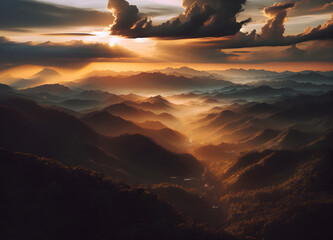 dramatic sunset in the mountains, sky in clouds and light through them