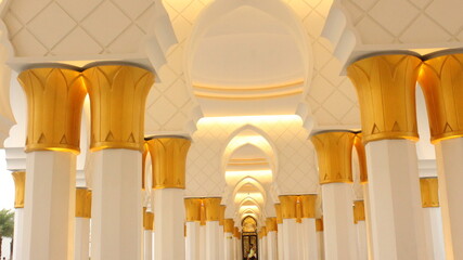 The majestic pillars inside the Sheikh Zayed Mosque, shaping a serene Islamic backdrop for the holy...