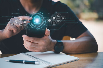 Cybersecurity and privacy concepts to protect data. Lock icon and internet network security technology. Businessman protecting personal data on smart phone with virtual screen interfaces.