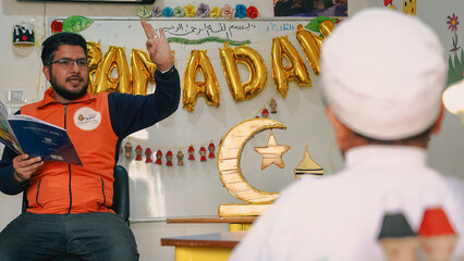 Ramadan storyteller. A teacher plays a storyteller role and tells Ramadan stories to children....