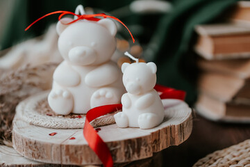 Bear shaped soy wax candles in the dark room, vintage decorations around