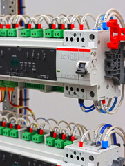 Electronic control modules for apartment automation are installed in an electrical distribution cabinet.