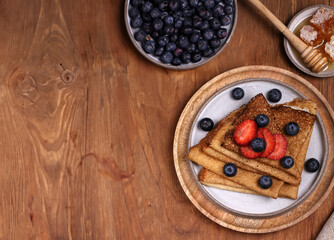 traditional thin pancakes with fresh berries