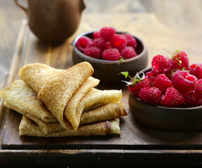 traditional thin pancakes with fresh berries
