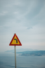 Road sign with bullet holes in Kefalonia, Greece - 754999826