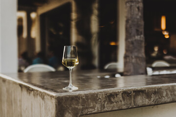 Champagne glass on a stone table in a restaurant - 755000418