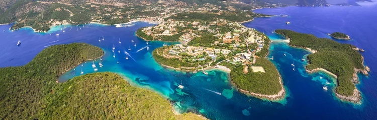 Fototapeten Sivota - stunning aerial drone video of turquoise sea known as Blue Lagoon and white sandy beaches. Epirus, Greece summer holidays © Freesurf