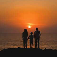 Family watching summer sunset by the sea