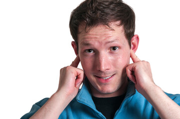 Man puts fingers in his ears