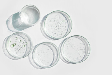 Petri dish, gel, flask, crystallization bowl. Test tubes, Laboratory. View from above. Medicine, gel texture, white, pipette, samples, research. Material collection. Glass baguette.