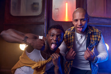 Two emotional guys performing hip-hop style in underground