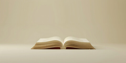 Open book on table with beige wall background