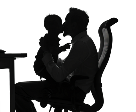 silhouette of father and son sitting on chair
