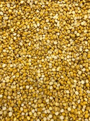 Split chickpeas or Chana Dal or split pigeon peas.