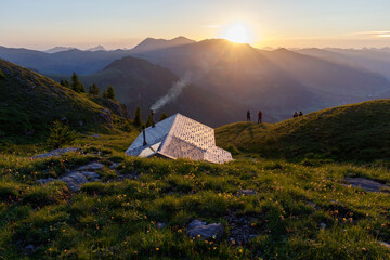 Sunset at swiss mountain hut fluhseeli in alpine mountain region