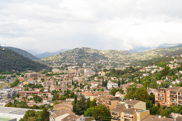 A city nestled at the foothills of towering mountains