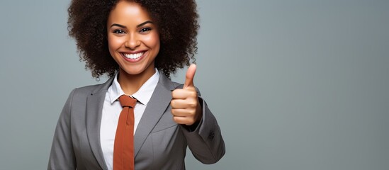Confident Businesswoman Shows Approval with Thumbs Up Gesture in Formal Attire