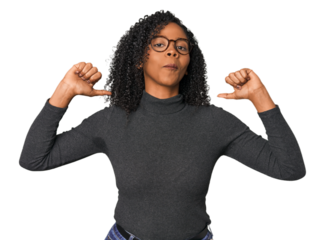 African American woman in studio setting feels proud and self confident, example to follow.