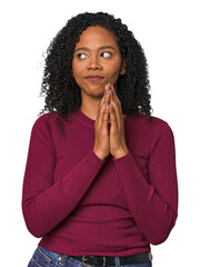 African American woman in studio setting making up plan in mind, setting up an idea.