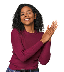 African American woman in studio setting feeling energetic and comfortable, rubbing hands confident.