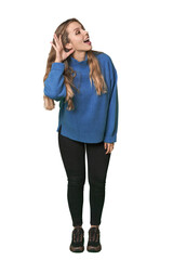 Fototapeta premium Studio portrait of a blonde Caucasian woman trying to listening a gossip.