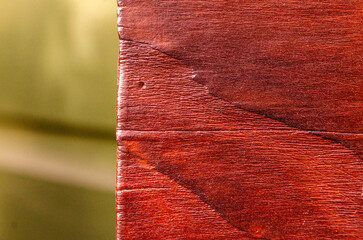 Close-up of garden bench treated with shou sugi ban by burning with a blow torch
