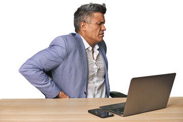 Elegant businessman at desk with laptop suffering a back pain.