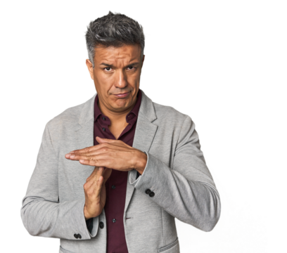 Middle-aged Latino man showing a timeout gesture.