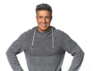 Middle-aged Latino man confident keeping hands on hips.