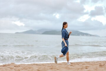Active Lifestyle: Young Women Runner Enjoying Beach Workout in Beautiful Summer Morning on Ocean Coast