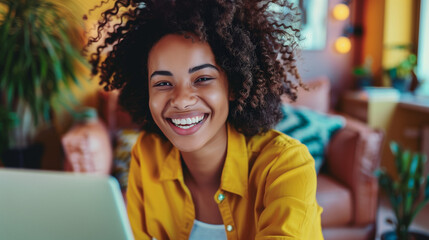Happy smiling african american female working remotely from home at her laptop. Positive and flexible work culture. AI generated - obrazy, fototapety, plakaty