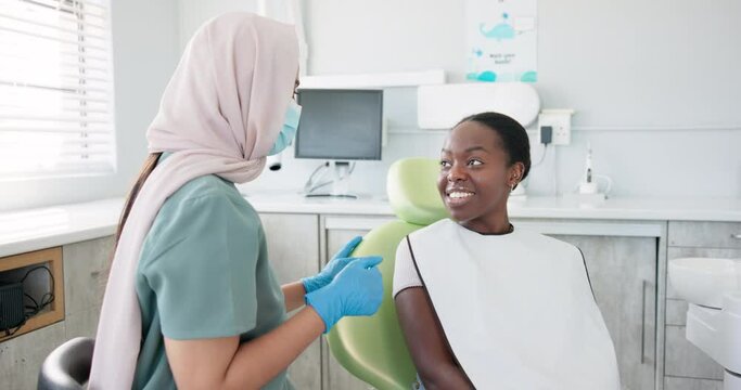Happy woman, dentist and patient with consultation for dental care, teeth cleaning or treatment at clinic. Young female person or orthodontist consulting customer for oral, gum or tooth whitening