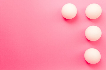 Pink background with white circles in the corner of the frame, stylized background with copy space