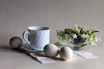 - Easter breakfast with coffee, white eggs and snowdrops