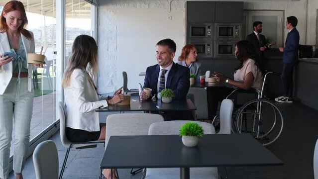 Group of coworking workers eating during break time. Concept: business, investment, success