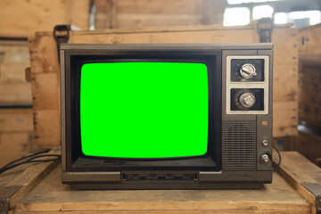 Old TV with green screen. Retro technology concept.