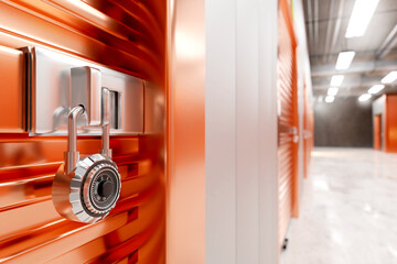 Code lock. Storage space is locked on locker. Lock on orange warehouse gate. Building with...