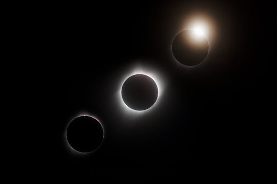 Composite image of a total solar eclipse sequence with three different stages photographed in Wyoming USA in 2017