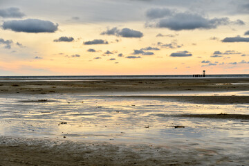 Sunset, wadden Sea at low tide on Amrum Island, North Sea, North Frisian Island,...