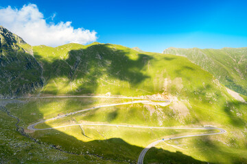 Tourism traffic on Transfagarasan pass. Crossing Carpathian mountains in Romania, Transfagarasan is one of the most spectacular mountain roads in the world. - 755078809